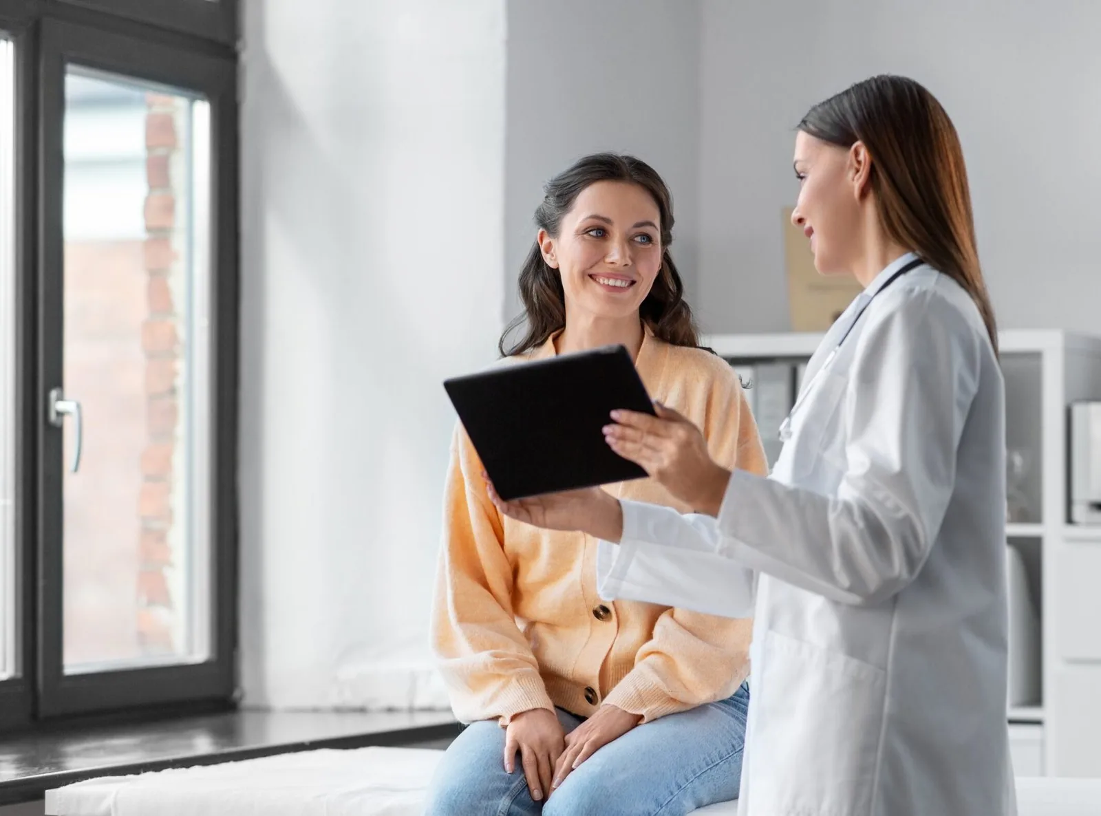 Clinician consulting with a patient about wellness care